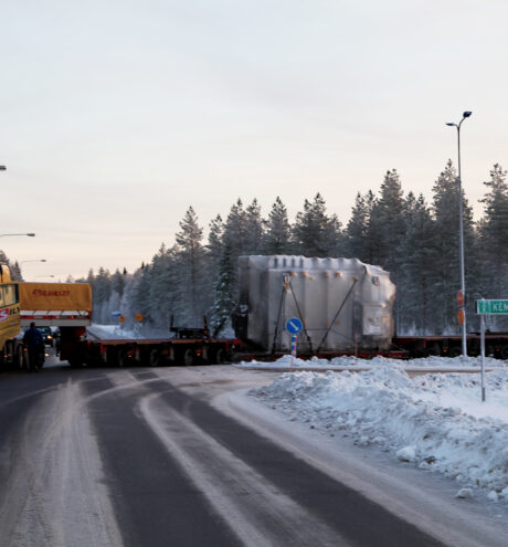 Silvasti truck and a trailer with a heavy transformer on a winter road