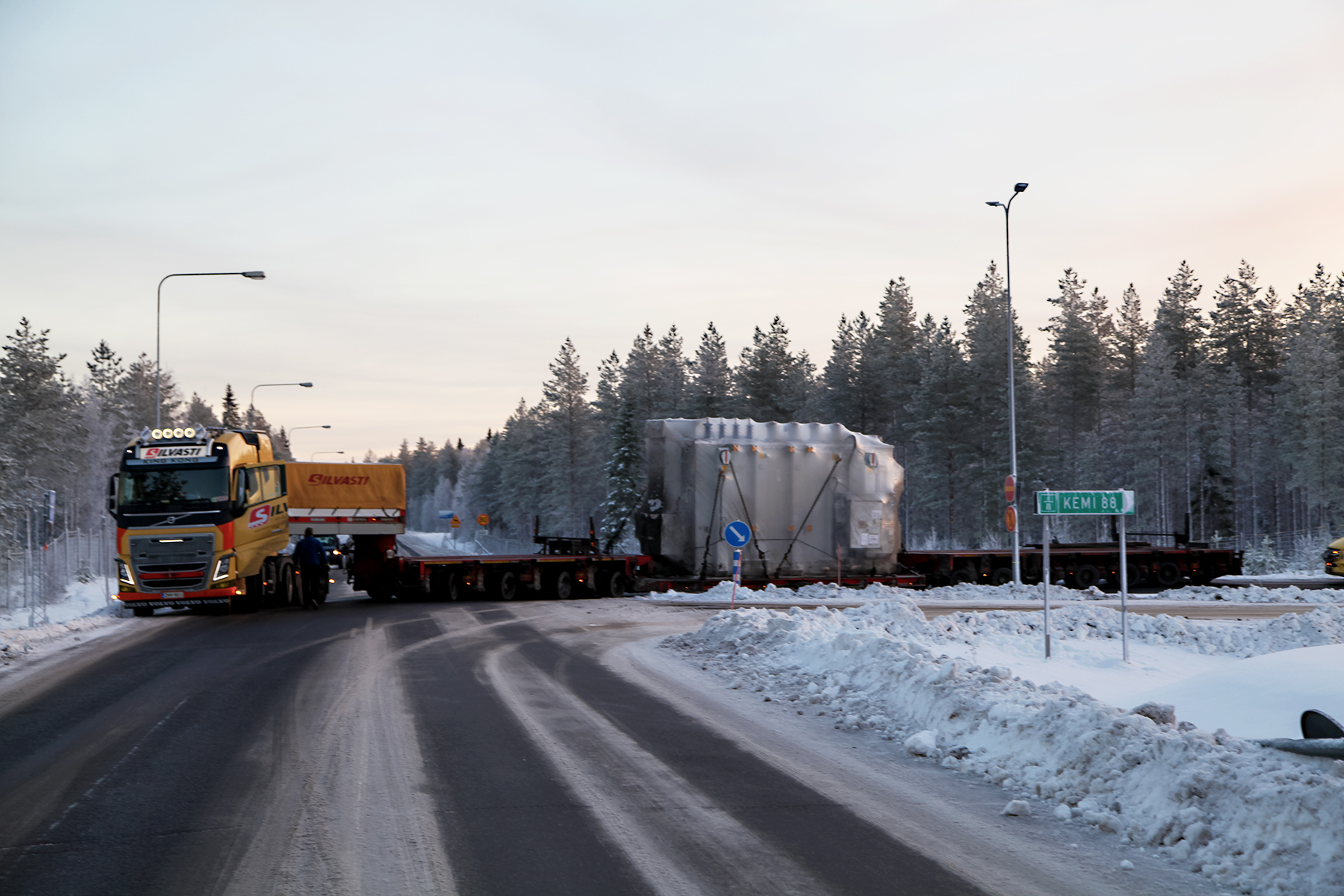 Silvasti truck and a trailer with a heavy transformer on a winter road